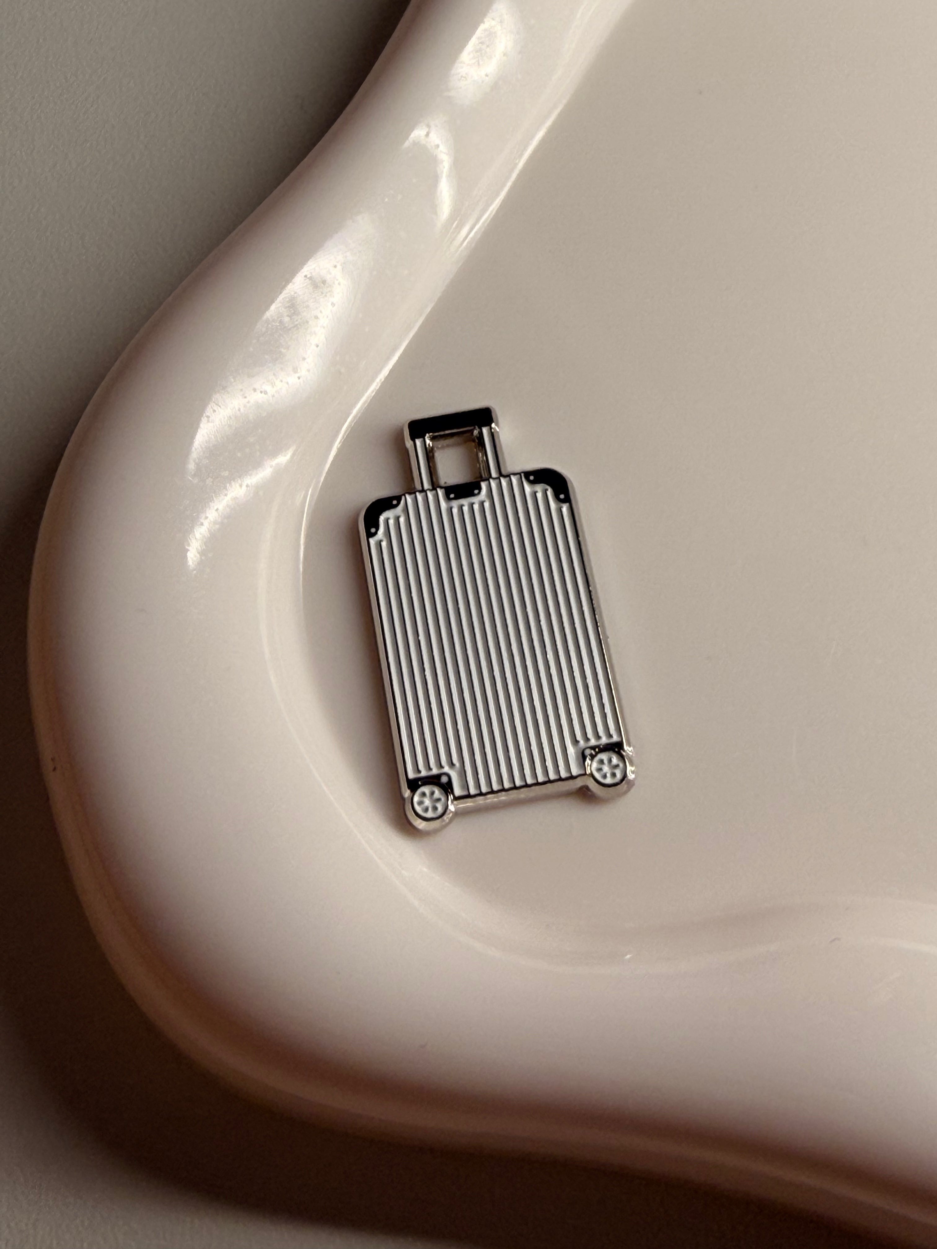 White suitcase metal sticker ￼